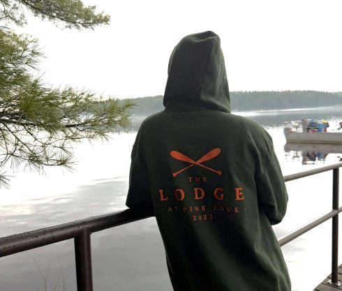 PersonstandingondocklookingatthewaterFrenchRiverOntarioCanadaWildernessLodge